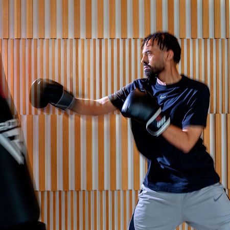 Hyatt Regency Riyadh Olaya Kültér fotó A boxer training with a heavy bag